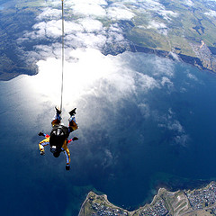 Jared Meadors of Medusa Properties Houston skydiving over Lake Taupo in New Zealand