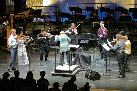 Andrew Norman’s Gran Turismo, with concertmaster Justin Bruns on the far left and principal second violinist Matthew Albert on the far right