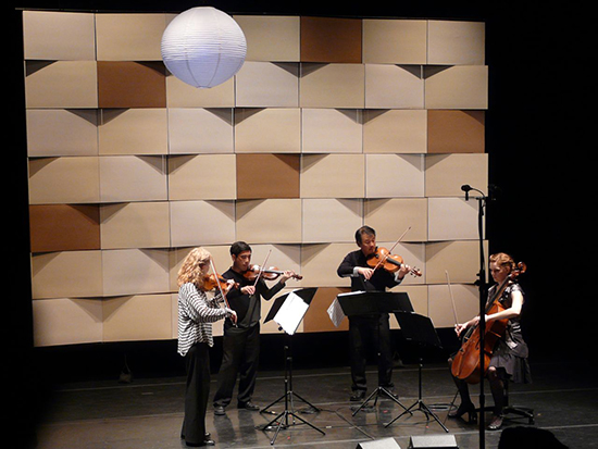 Kate Stenberg, Rick Shinozaki, Charlton Lee and Kathryn Bates Williams (left to right), performing in front of a set by Nick Noyes Architecture