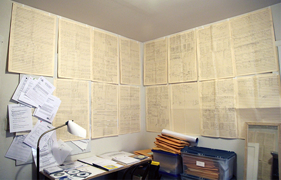Score pages posted on the walls of Carl's office
