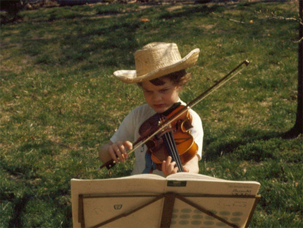 Trueman as a young violin student