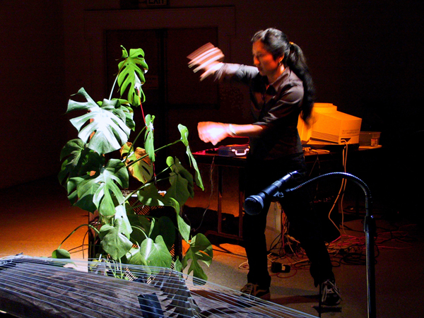 Masaoka performing with plants