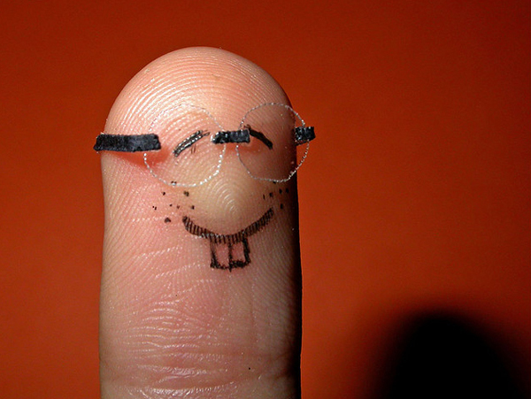 Photo of finger painted to look like a nerd ,with glasses etc.