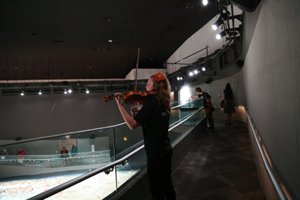 Violinist Ruby Pine performs In Space at Queens Museum