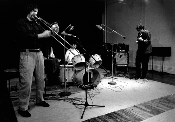 Staley playing trombone with Ikue Mori on drums and Bill Frisell on guitar