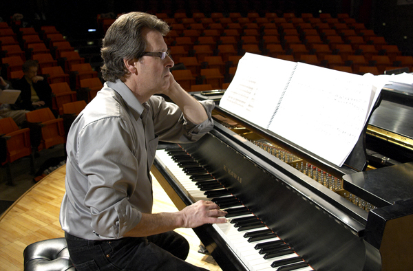 Stephen Paulus at the piano during a rehearsal for his ChoralQuest piece.