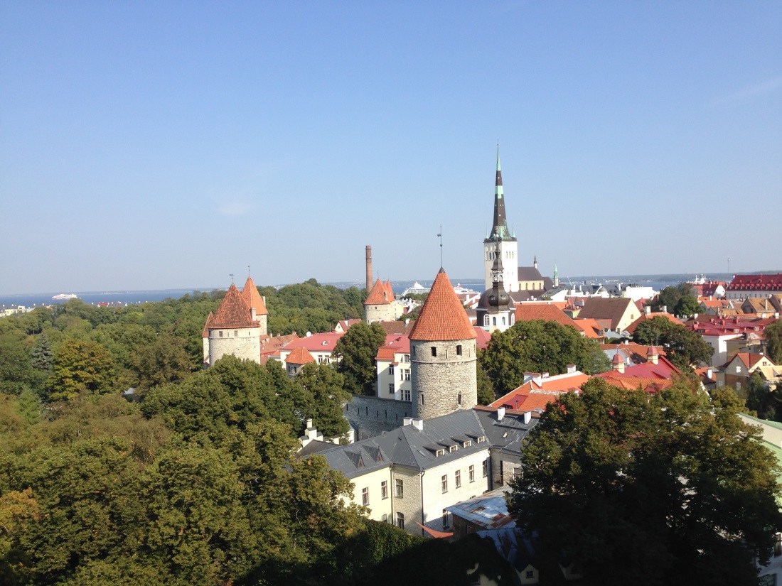 An aerial view of Tallinn, Estonia, showing the rooftops of old buildings