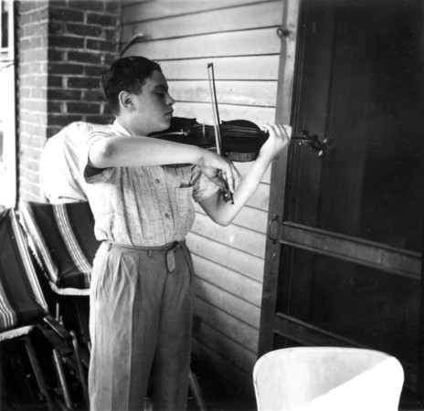 A young Samuel Adler playing the violin.