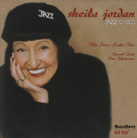 Cover of CD Jazz Child which features a picture of Sheila Jordan wearing a cap that says jazz, smiling, and with her right hand on her right cheek. 