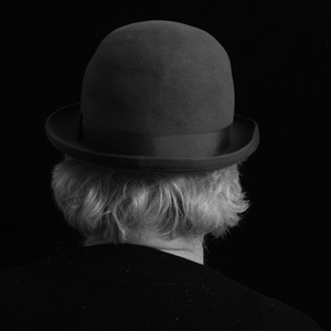 A photo of the back of Charlie Morrow's head, wearing a Bowler hat