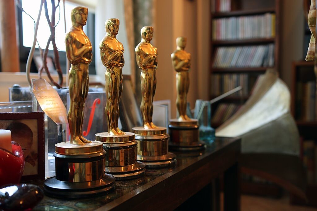 André Previn's four Oscars sit together on a table near the window in his living room.