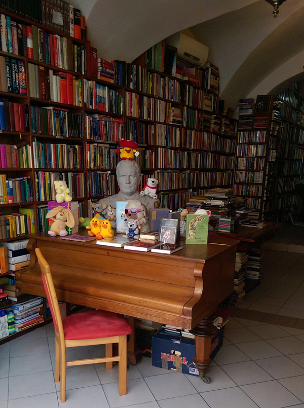 At a used book store in Ljubljana a grand piano is covered with plush toys and a statue of former Yugoslavian dictator Josip Tito.