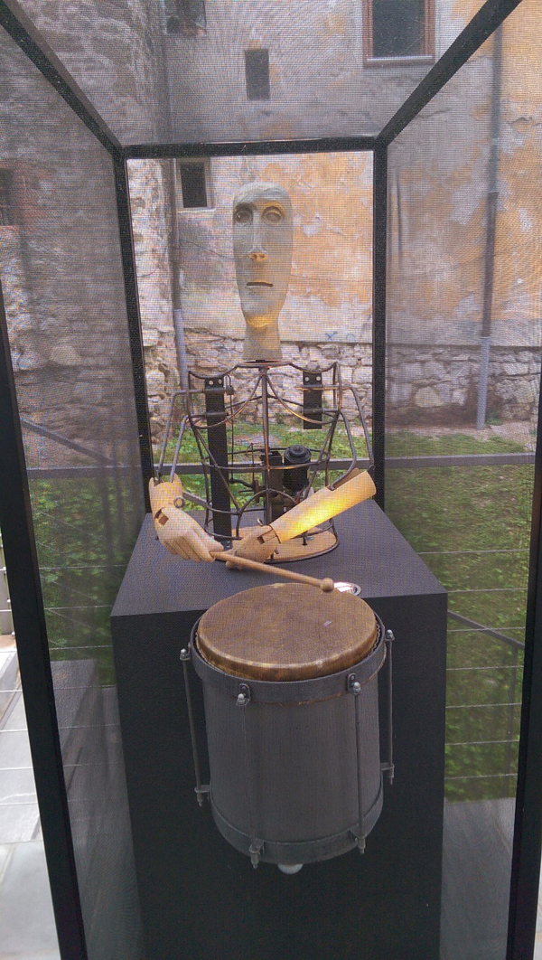 A sculpture of a man playing a tenor drum that actually moves.