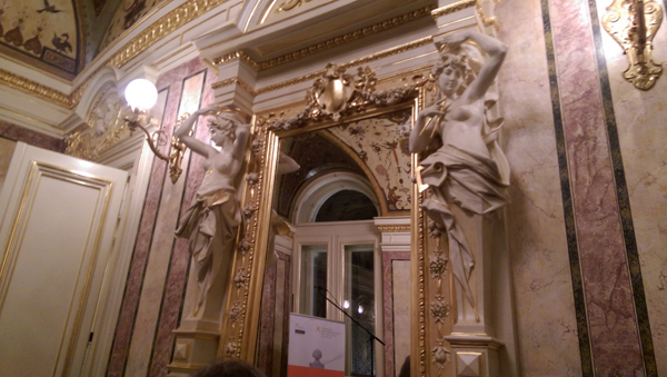 One of the doorways of the extremely ornate Orfejev Salon whose side beams are two larger than lifesize sculptures of women.