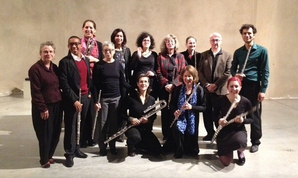 Photo of 13 people, many holding flutes.