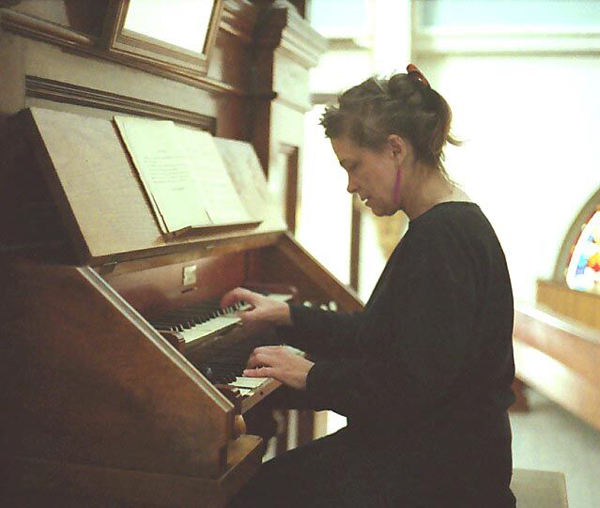 Mary Jane Leach playing a church organ.