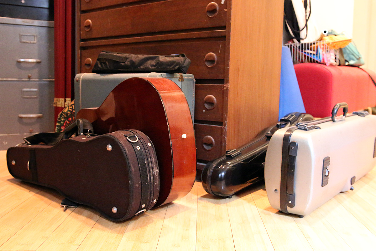 A bunch of instrument cases on the floor.
