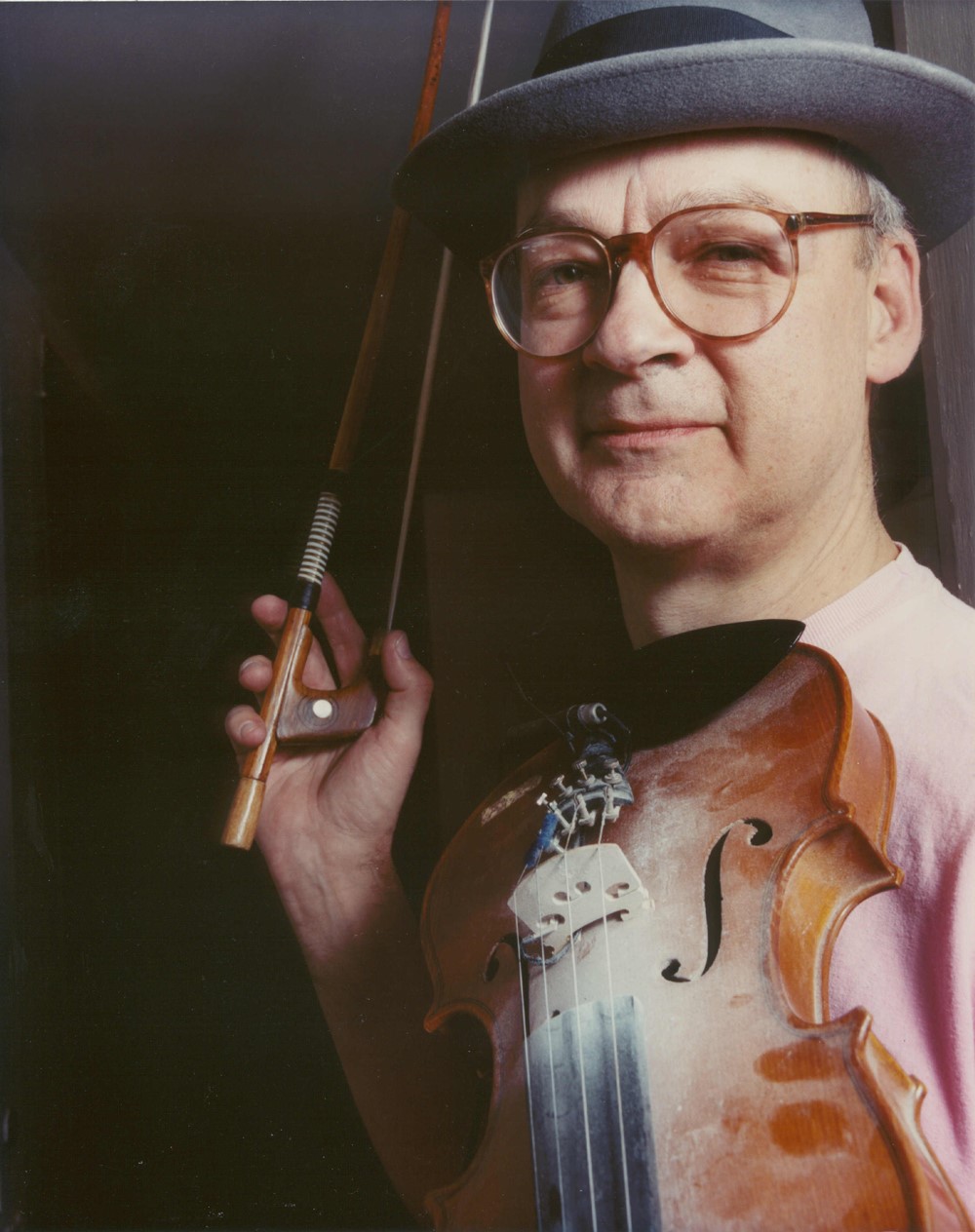 Tony Conrad holding violin
