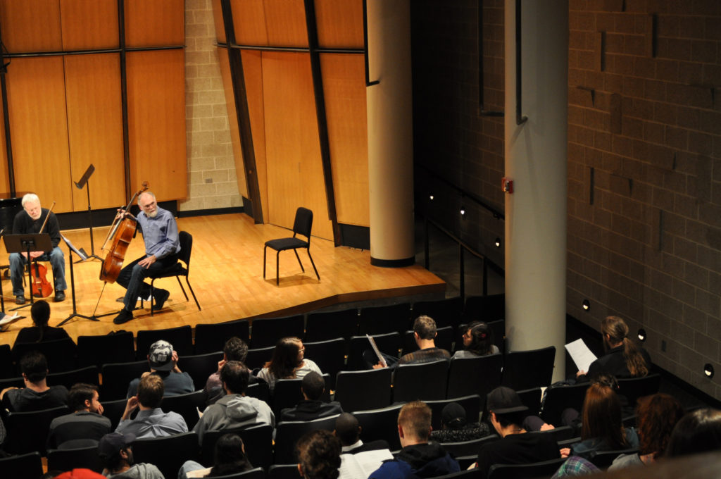 Cellist and Playground Ensemble member Richard vonFoerster gives feedback to the composer.