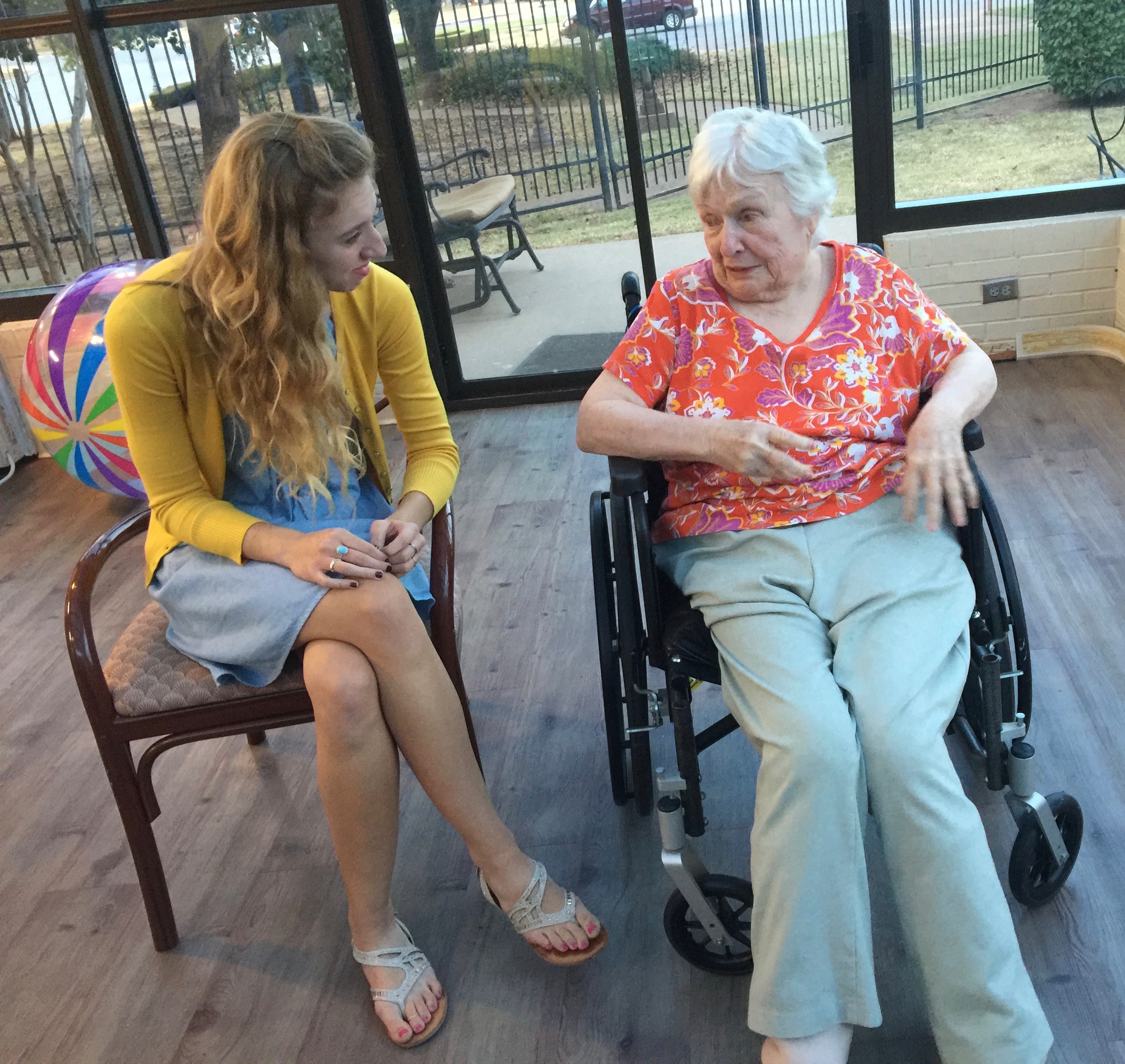 Music and Memory Team member Andrea Larson talking with one of the residents at the Baptist Village Community retirement facility.