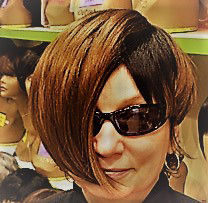The author posing with wig and sunglasses for her alias Madison Goodwin 