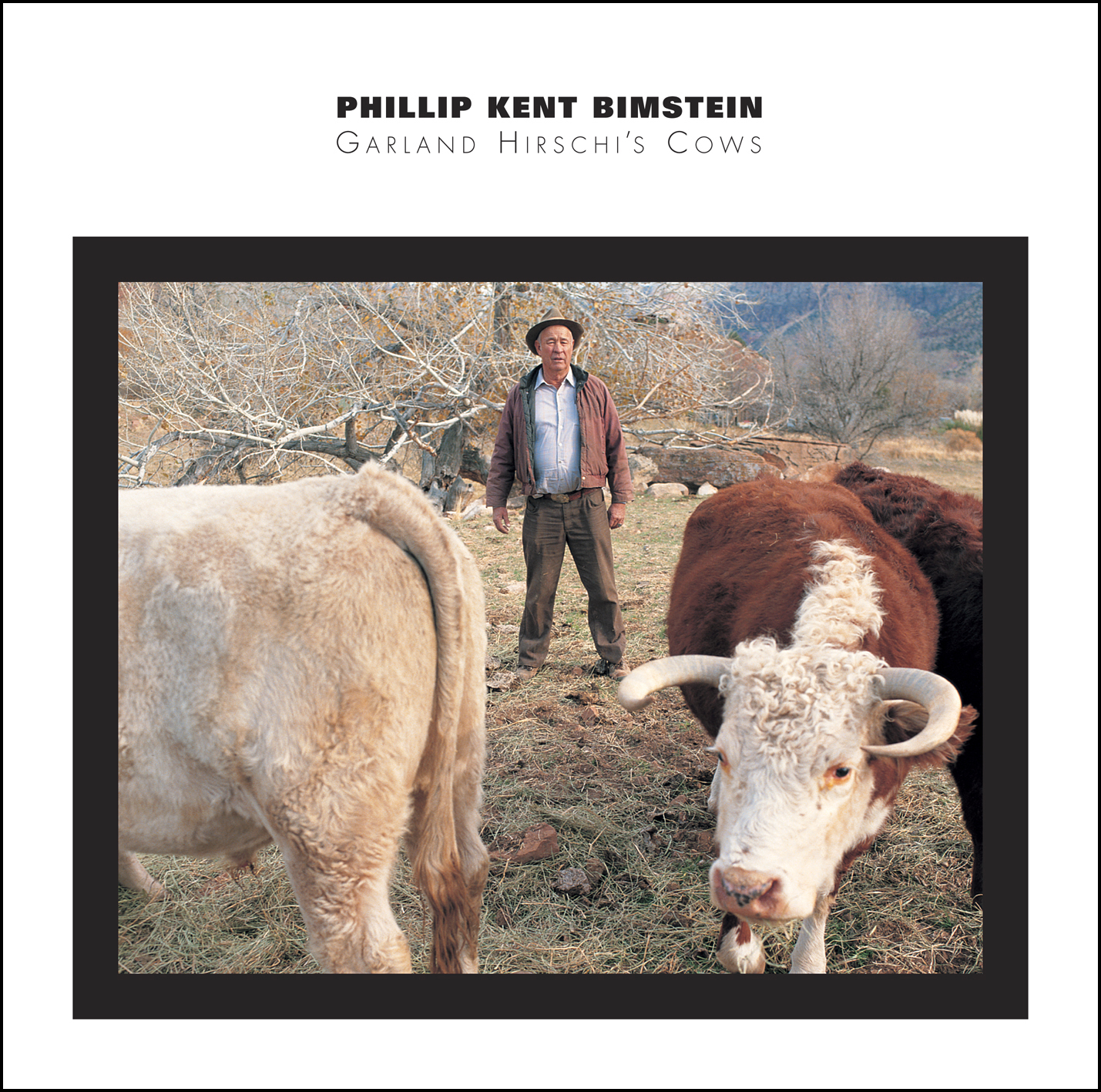 The cover for Philip Bimstein's Starkland CD Garland Hirschi's Cows which is a photo of a farmer with a pair of cows.