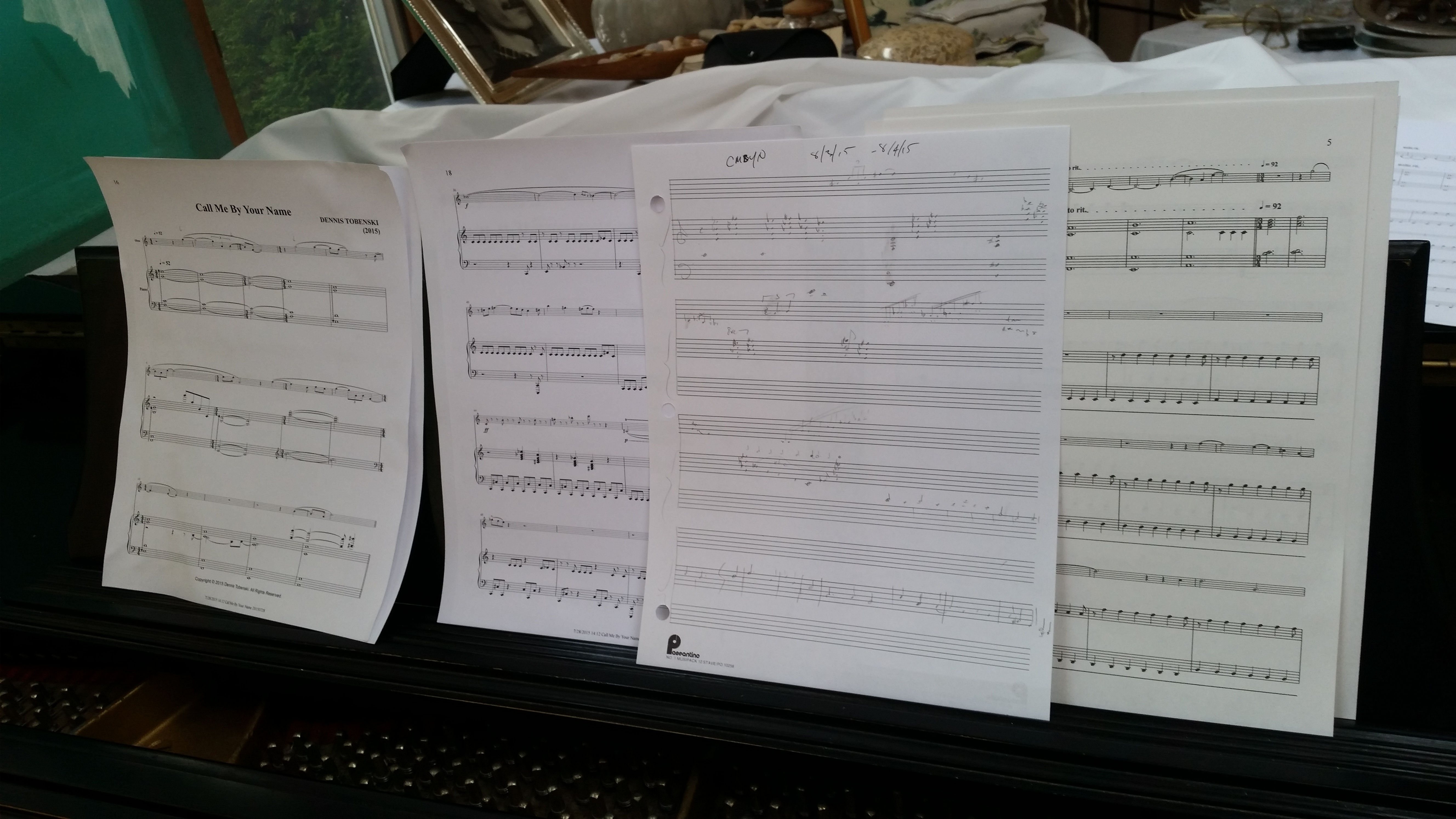 Pages of sheet music from four different projects