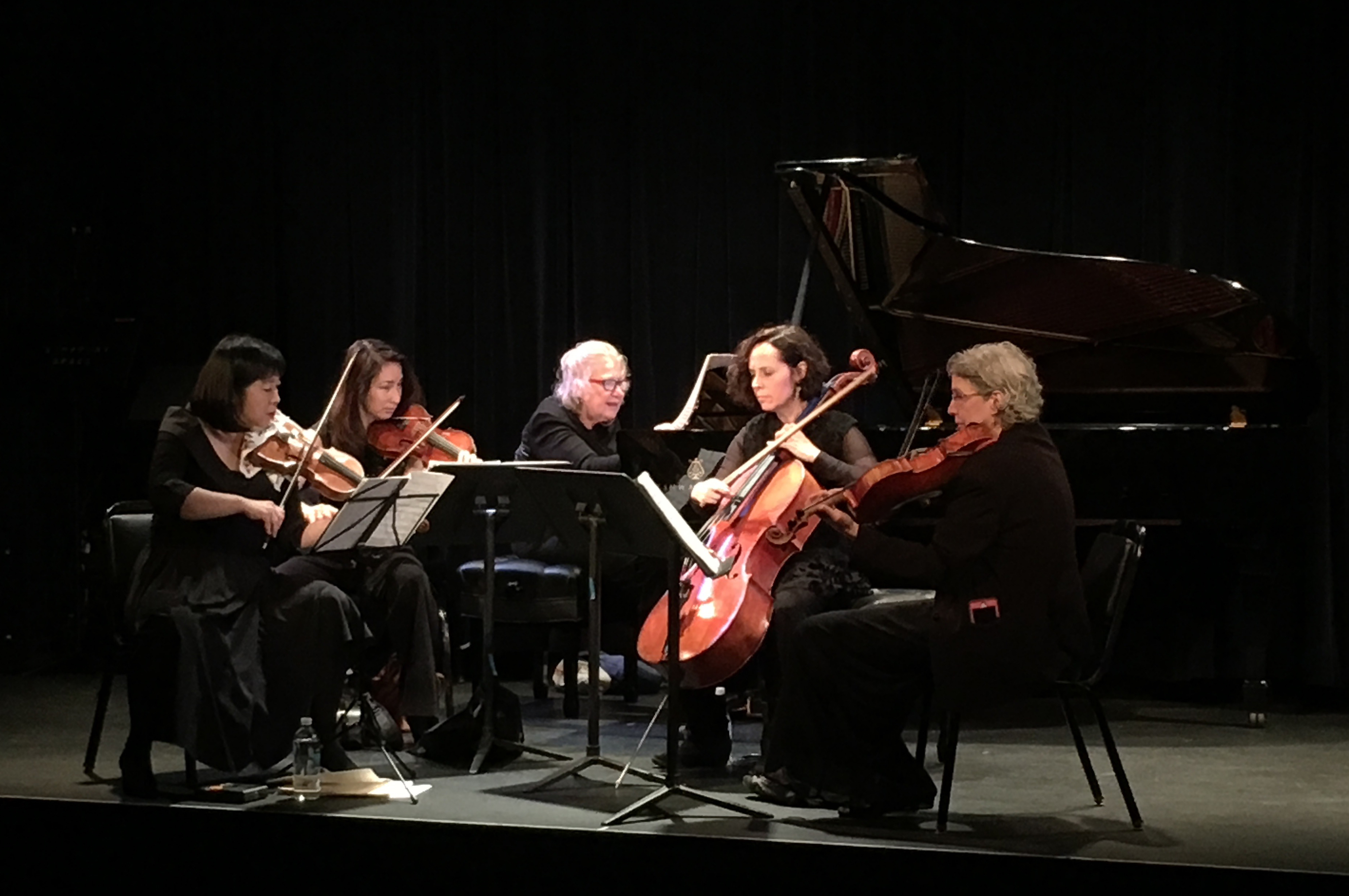 The Cassatt String Quartet performing onstage with pianist Ursula Oppens