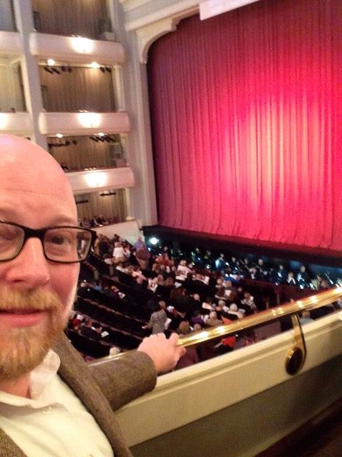 Pesci in a tweed jacket inside Bass Hall for a performance by the Ft. Worth Opera