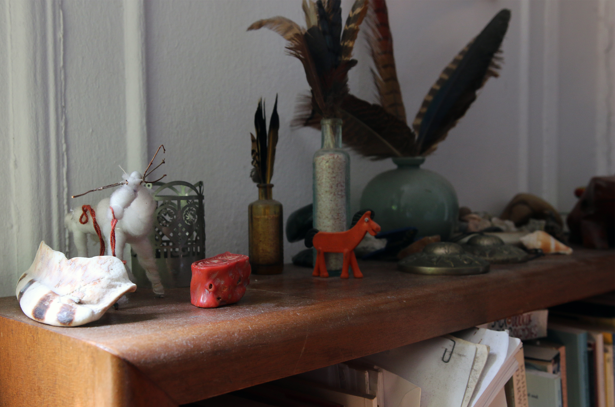 A shelf in Norderval's apartment containing various art objects and musical instruments.