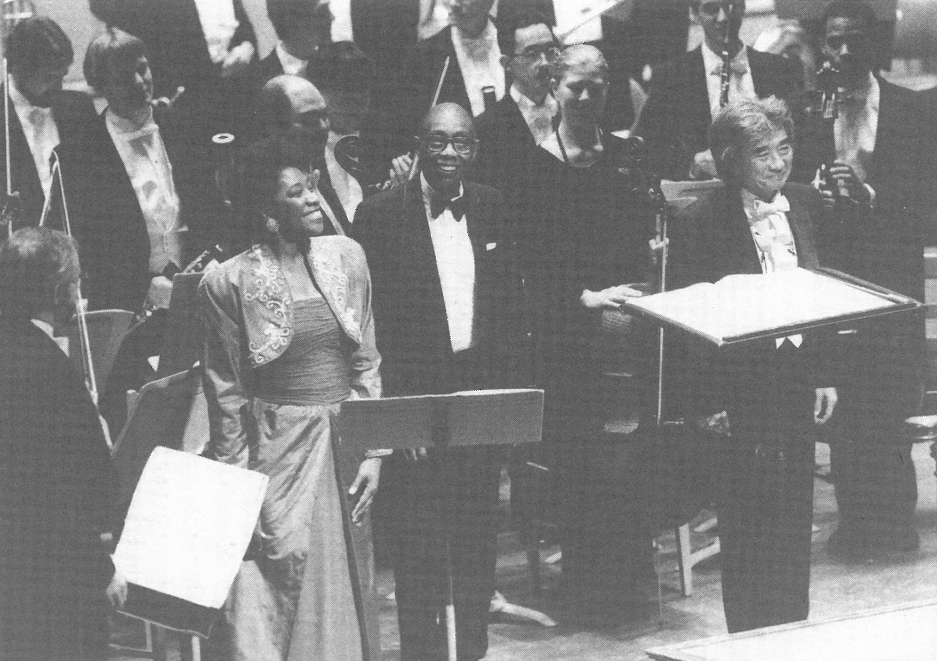 Historic photo of soprano Faye Robinson, George Walker, and conductor Seiji Ozawa with the Boston Symphony Orchestra on the stage of Orchestra Hall in Boston in 1996.