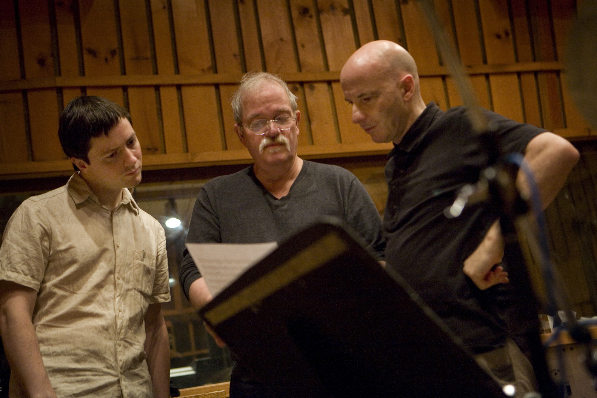 Thomas Morgan, John Abercrombie and Joey Baron looking over a score during the recording session for the 2009 album Wait Till You See Her (Photo © Robert Lewis, courtesy ECM).