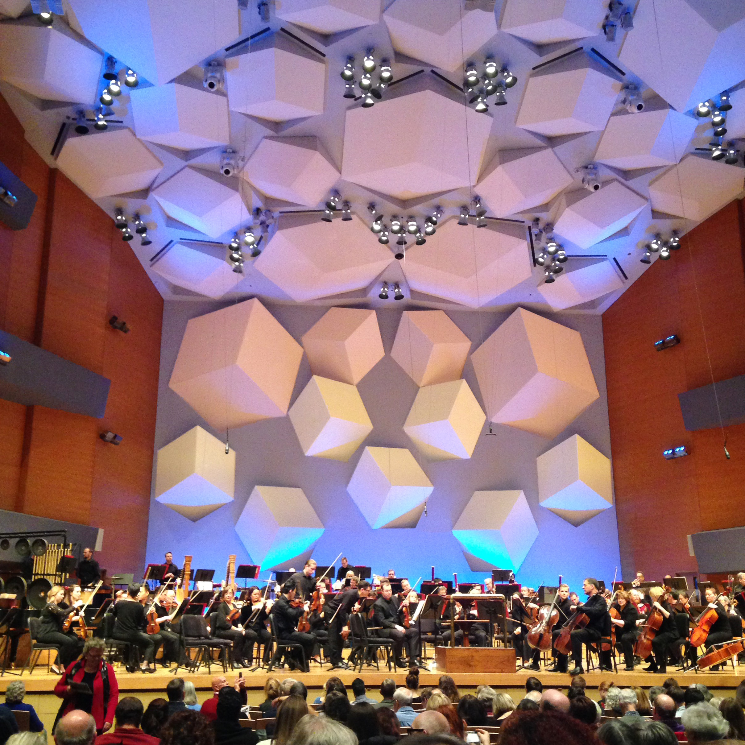 The Minnesota Orchestra onstage at Orchestra Hall performing in front of a near capacity audience.