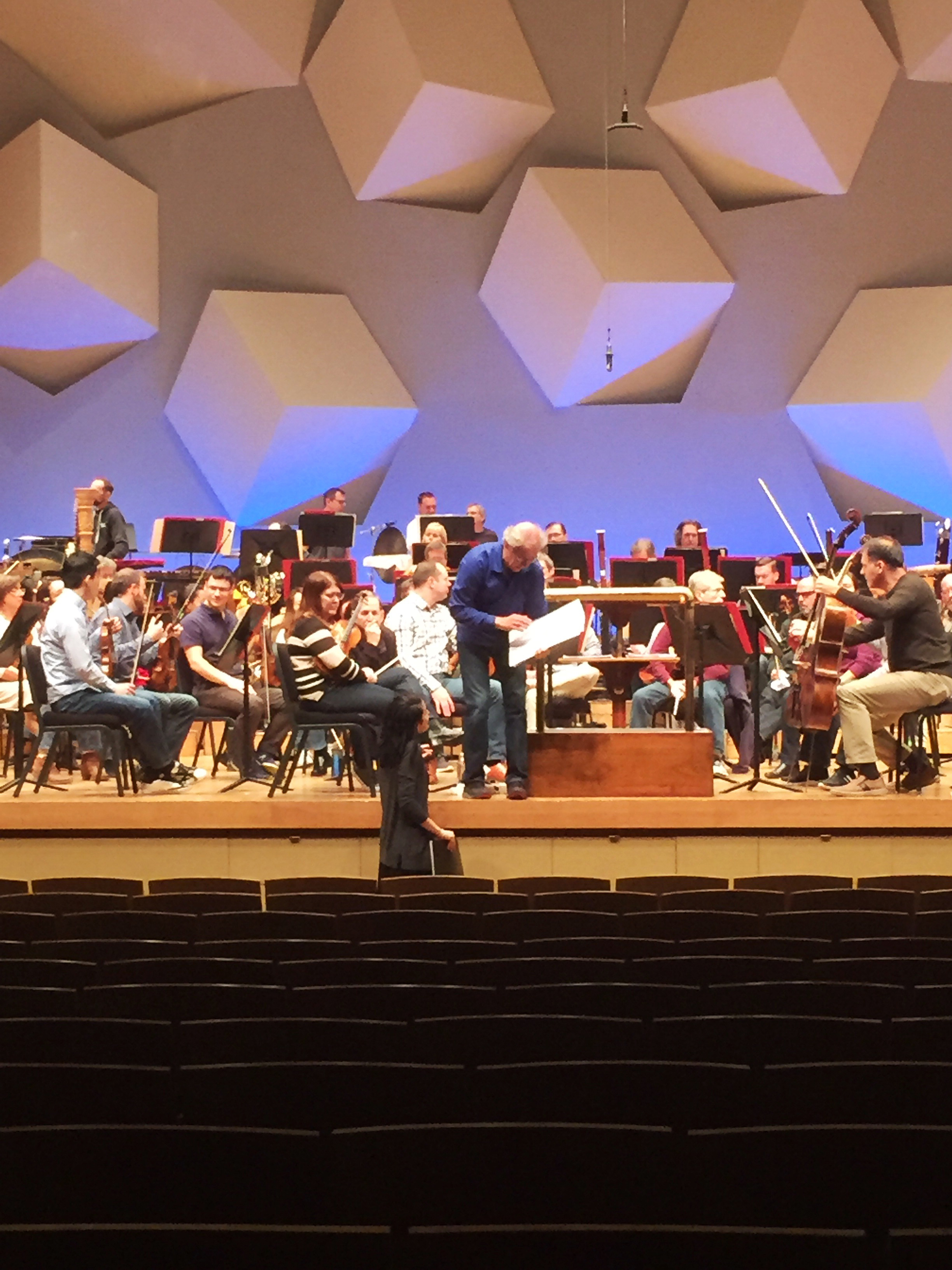 Hilary Purrington with score in hand discusses a detail in her score with Osmo Vänskä during a rehearsal with the Minnesota Orchestra.