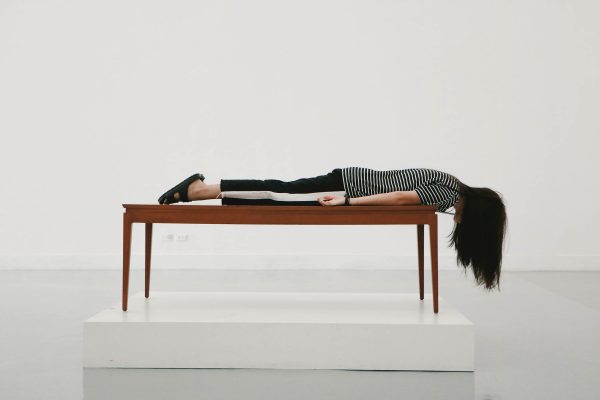 woman face down on table