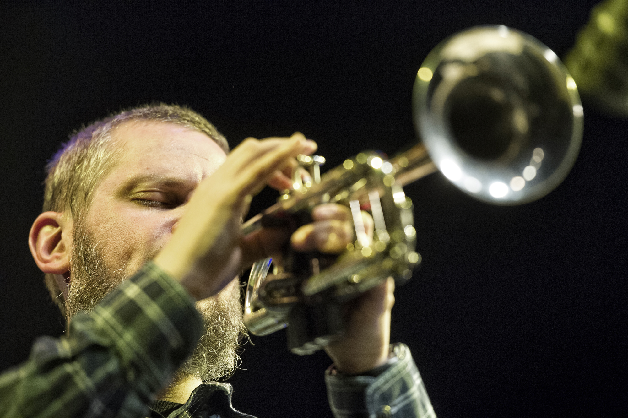 Nate Wooley playing a trumpet (photo by Ziga Koritnik)