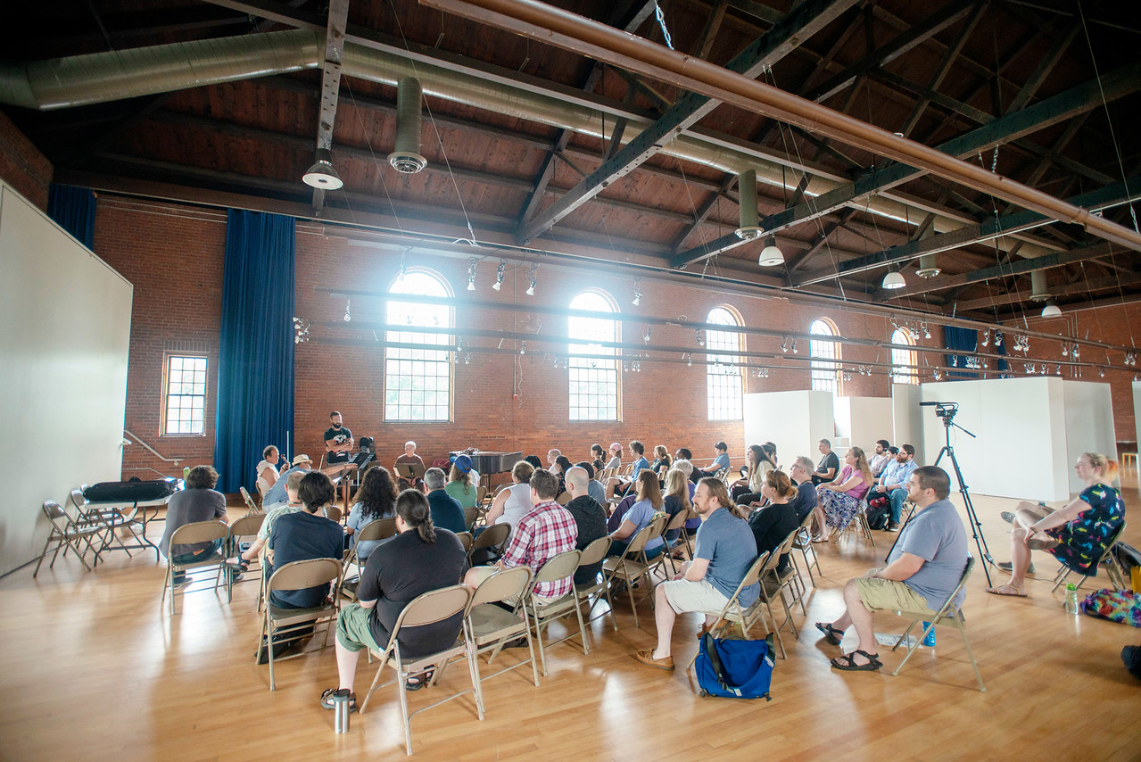 The VCFA community listens to a talk by the members of the Sirius Quartet at VCFA's Alumni Hall during the summer 2018 residency (Photo by Jay Ericson, courtesy VCFA)