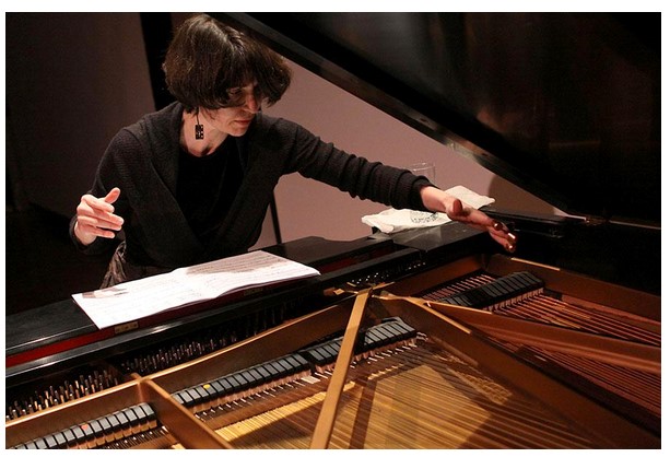 Idith Meshulam Korman playing the piano