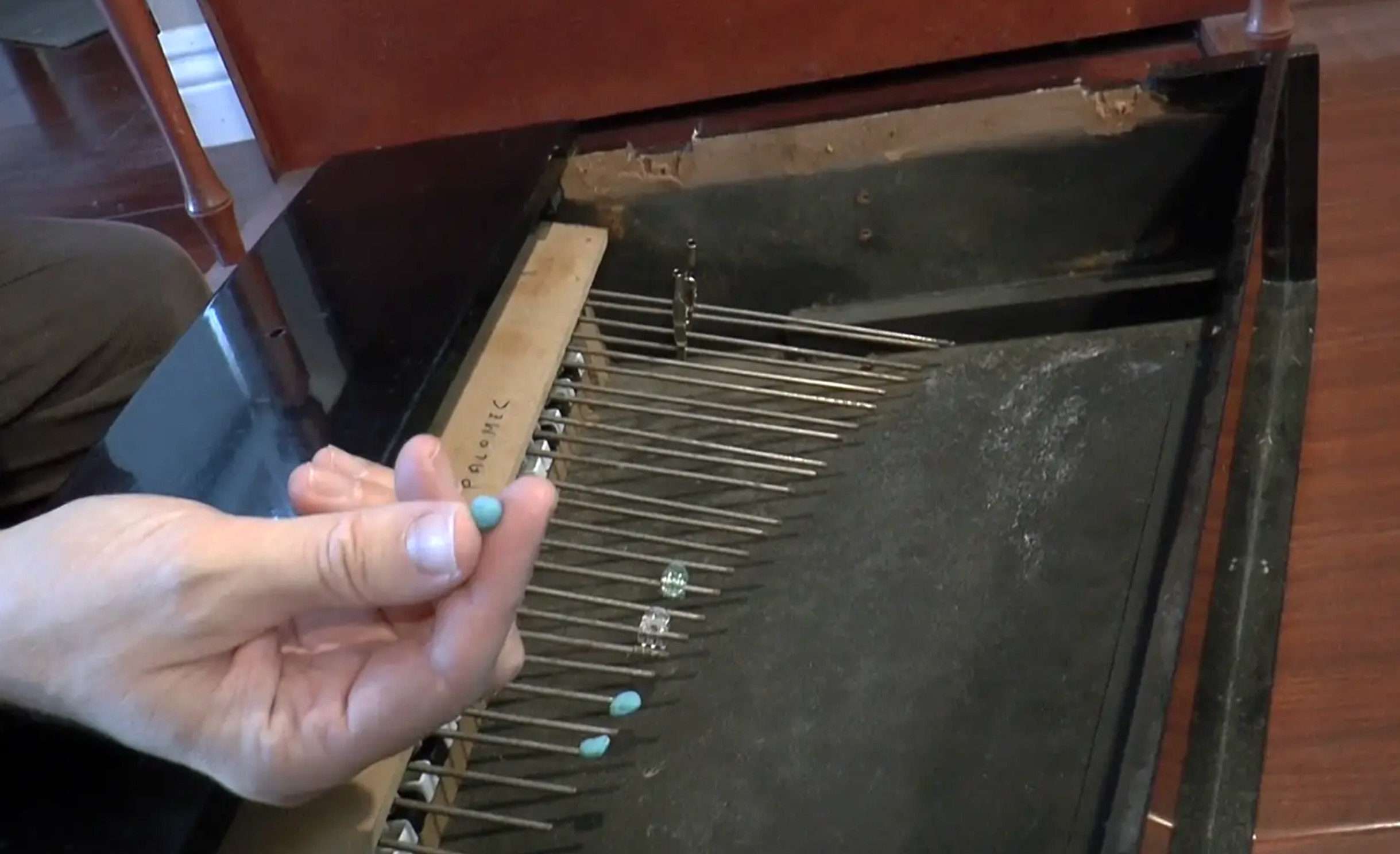 Hand inside toy piano
