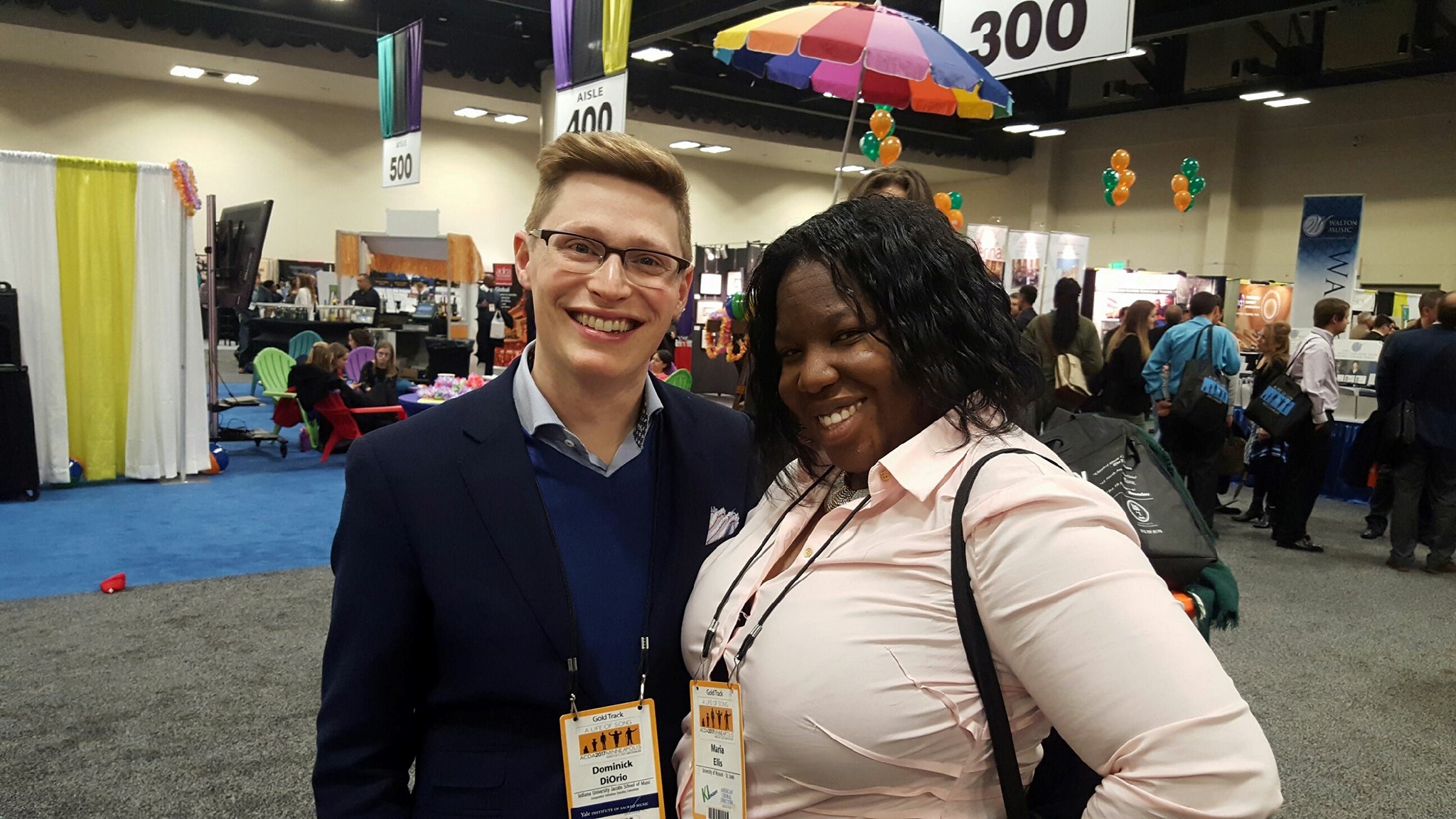 Dominick at the exhibit hall in Minneapolis in 2017 with conductor Maria Ellis.
