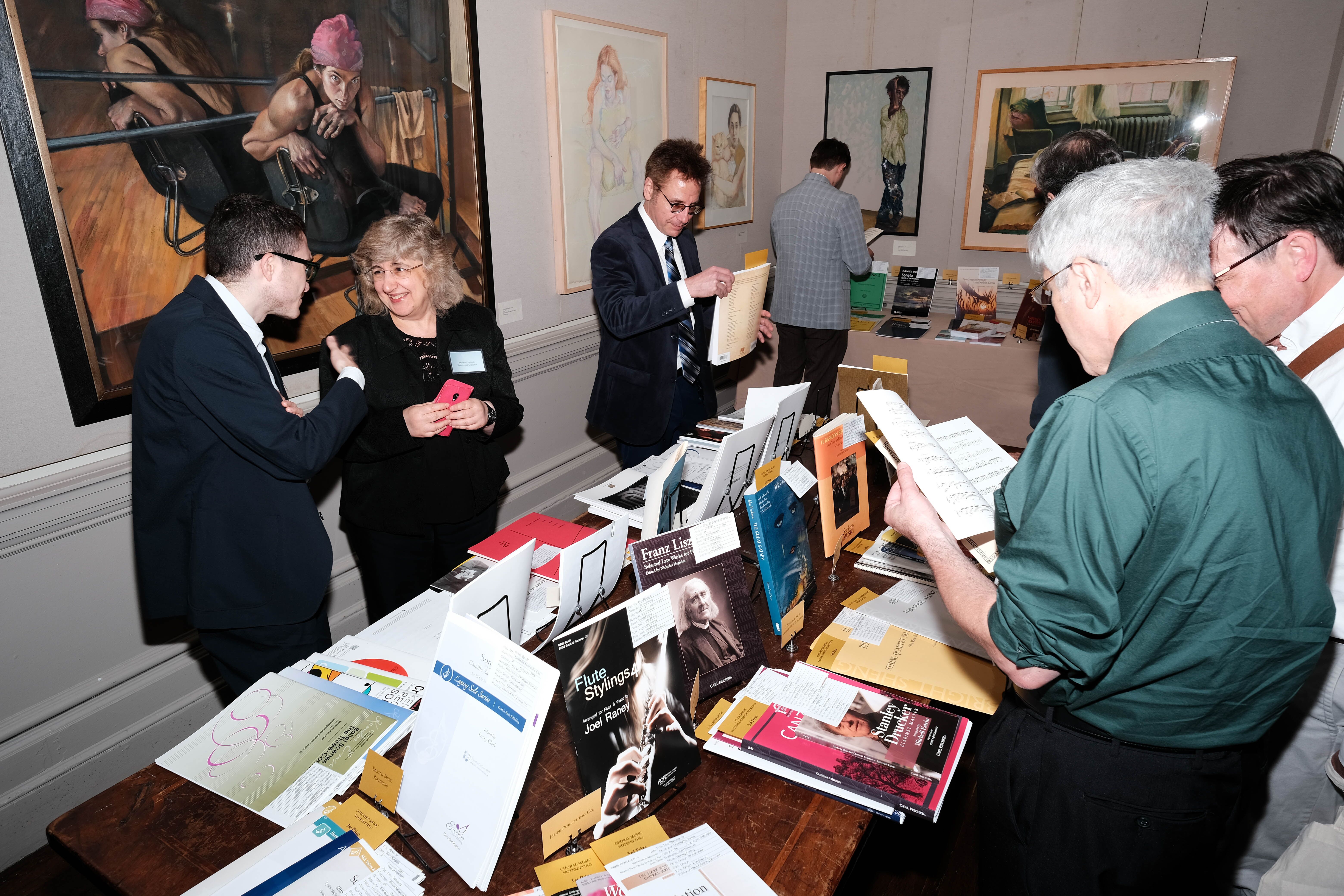 MPA annual meeting attendees examine the 2019 Paul Revere Award-winning scores