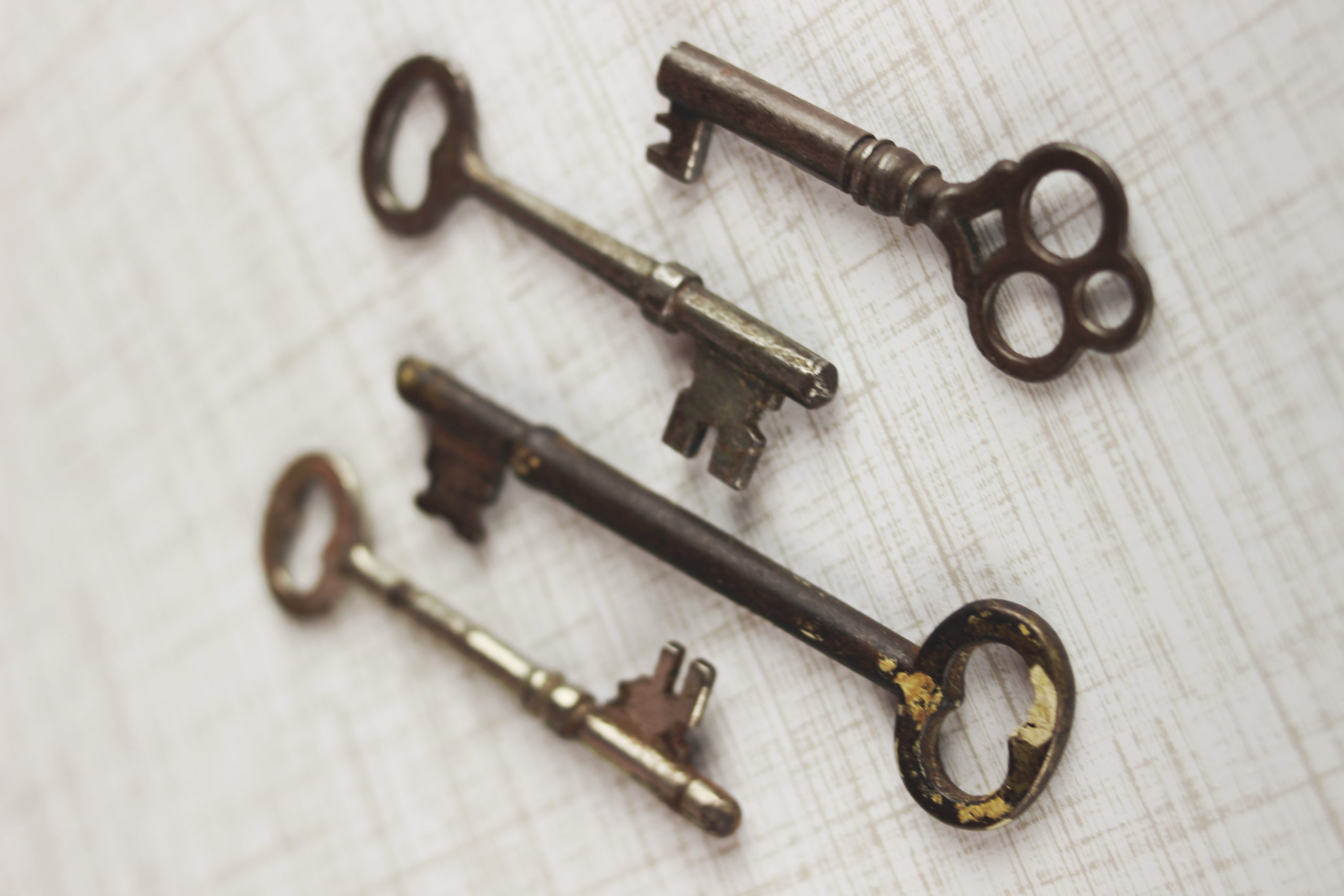 Four old fashioned metal keys.