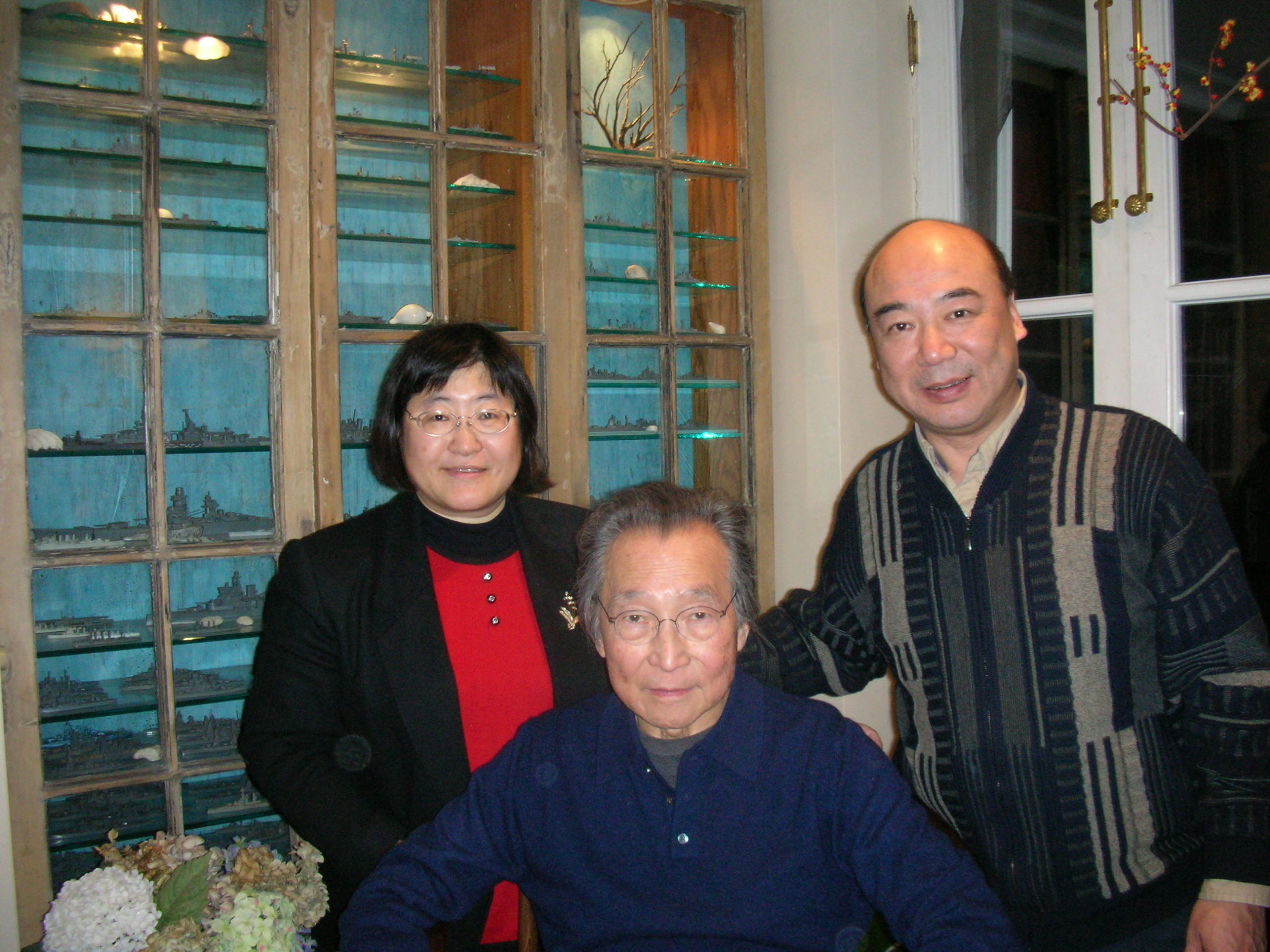 Three people posing together for a photo