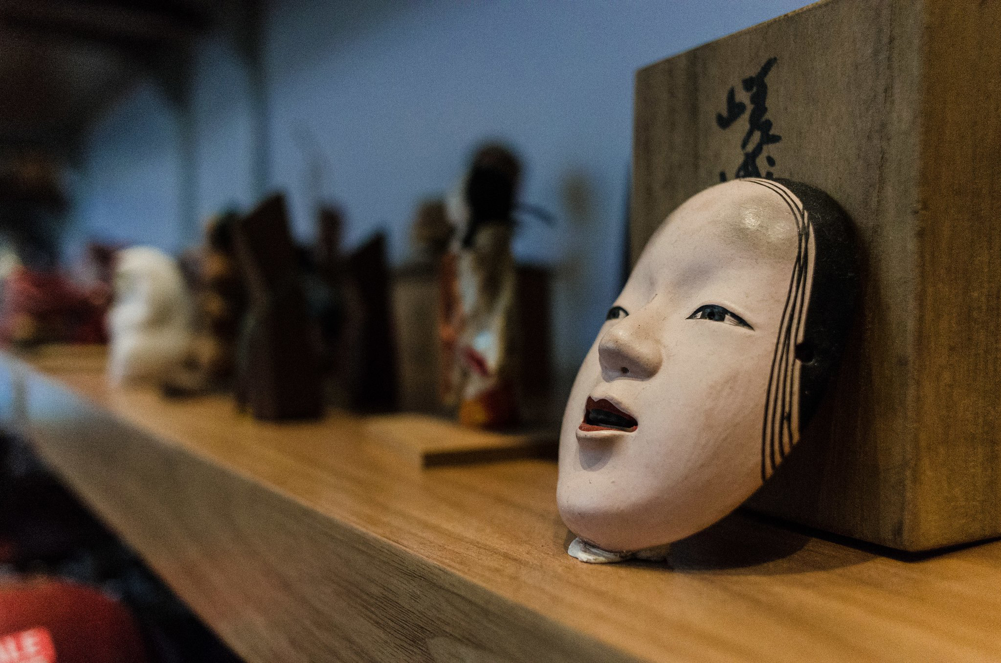 A Japanese face mask on a shelf