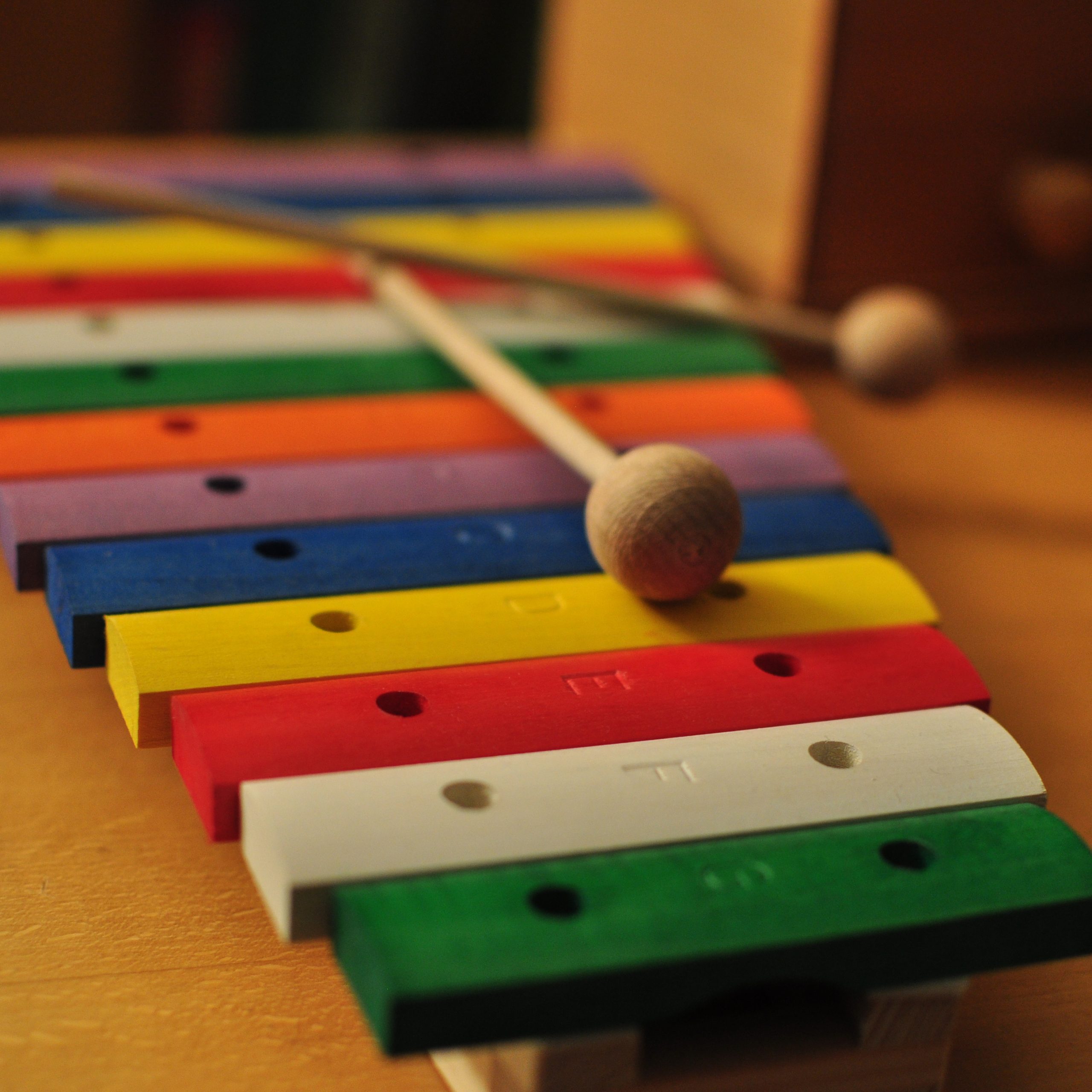 A diatonic toy xylophone, each key is a different color.