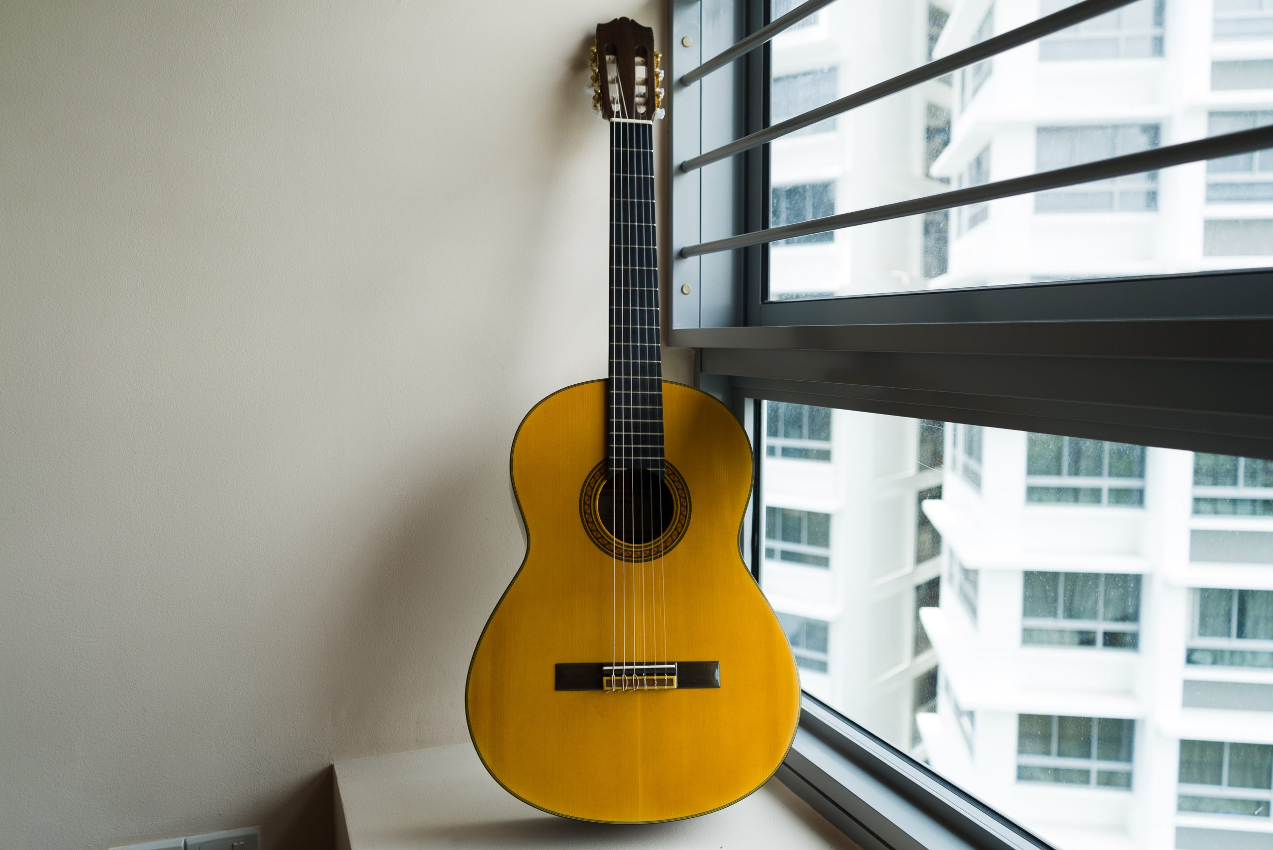 Guitar near open window