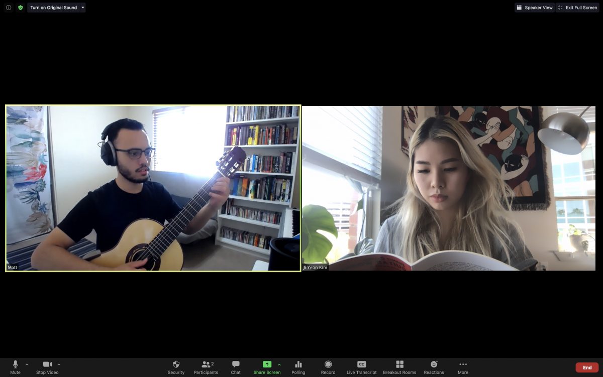 A zoom screenshot of a guitar lesson. Matt playing guitar and Jiji following along with the score.