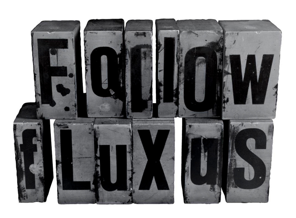 The logo for Follow Fluxus is a series of boxes which each have printed on them one letter: "F," "o," "l," "l," "o," "w," "F," "l," "u," "x," "u." and "s."