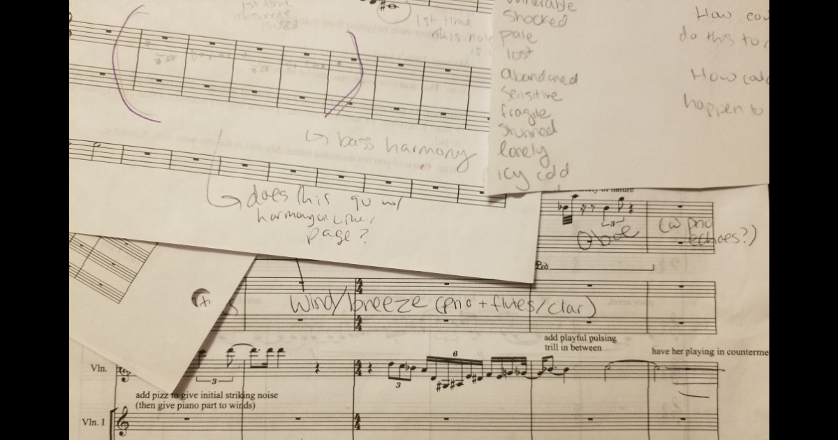 Overlapping pages of an engraved orchestral score with various notes in pencil overlayed.