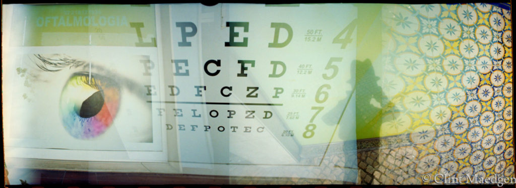An original photograph by Clint Maedgen collaging an eye, a eye chart, and a carpet.